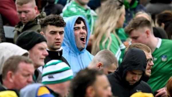 A supporter yawns as he awaits power to be restored to the stadium. Pic: Brendan Moran/Sportsfile