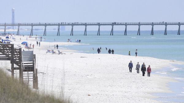 Florida authorities warn of shark dangers after three people are attacked